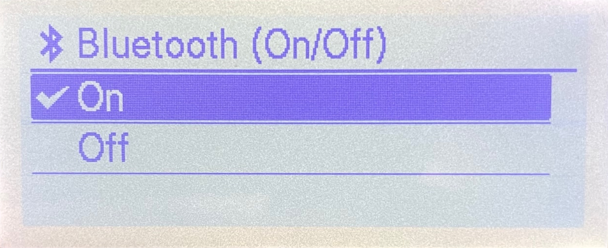 Brother TD-4550DNWB label printer LCD display showing Bluetooth (ON/OFF) menu with Bluetooth enabled.