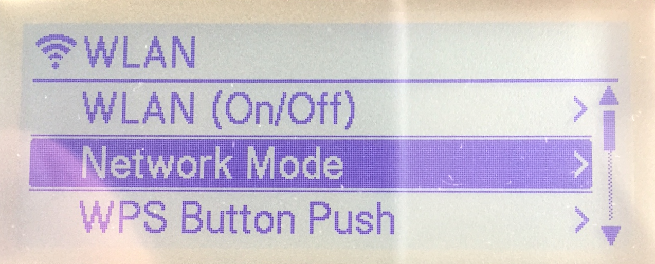 Brother QL-820NWB label printer LCD display showing the WLAN network mode menu.