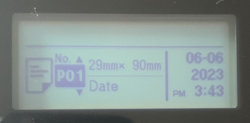 Brother QL-820NWBc label printer LCD display showing the Template mode menu and label size.