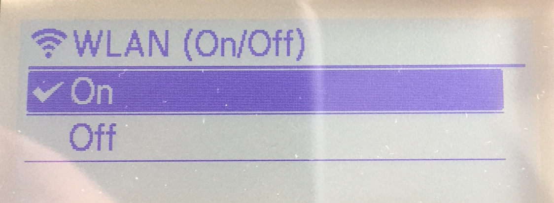 Brother QL-820NWBc or QL-820NWB label printer LCD display showing the WLAN menu with the WLAN activated.